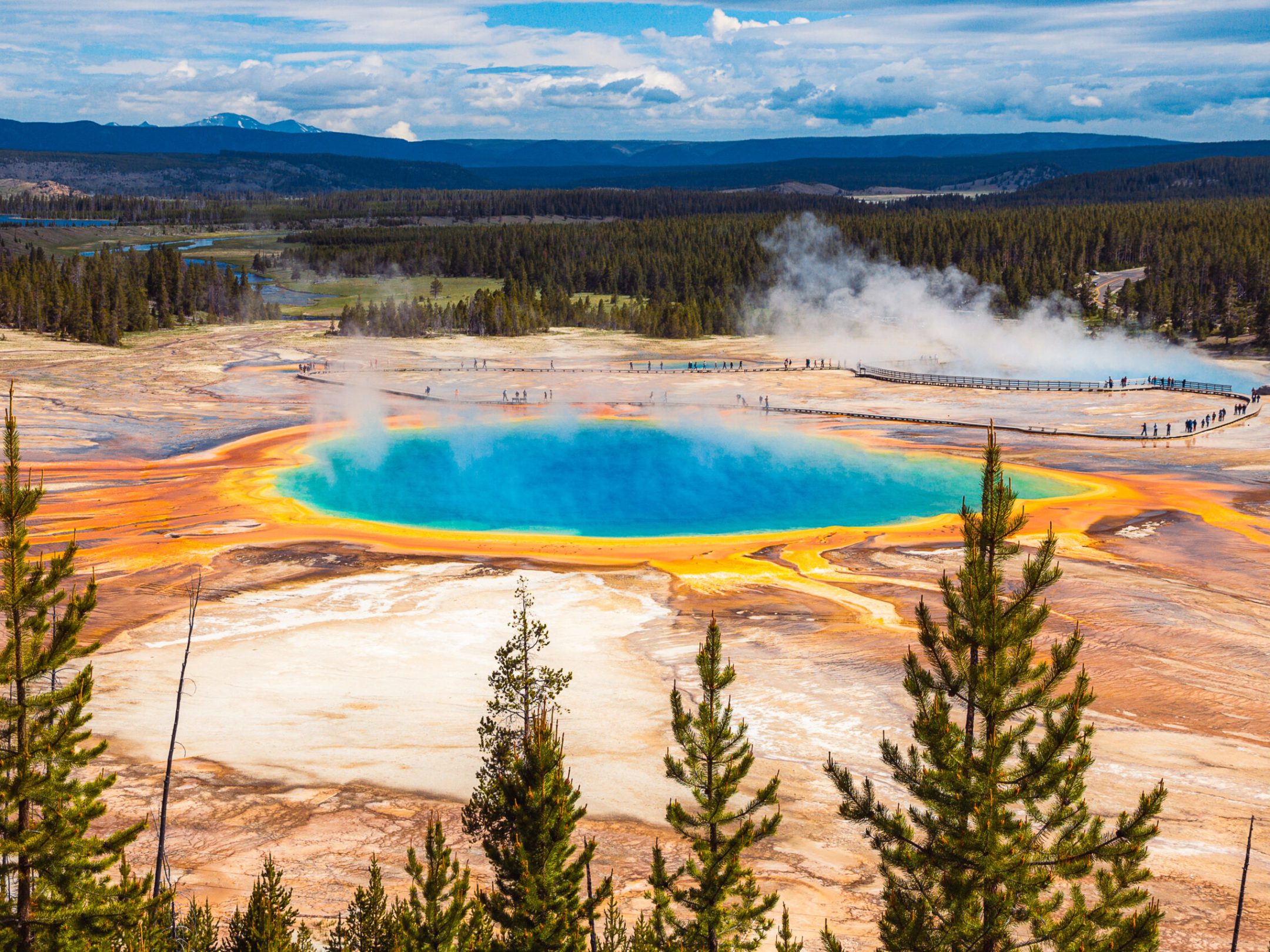 Grand Prismatic Hot Spring is vibrant and visible as air temperatures rise in spring and summer.