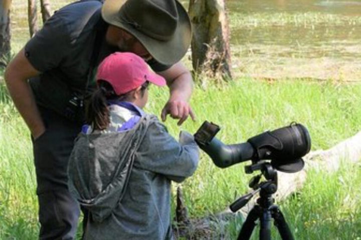 a person standing in front of a tripod