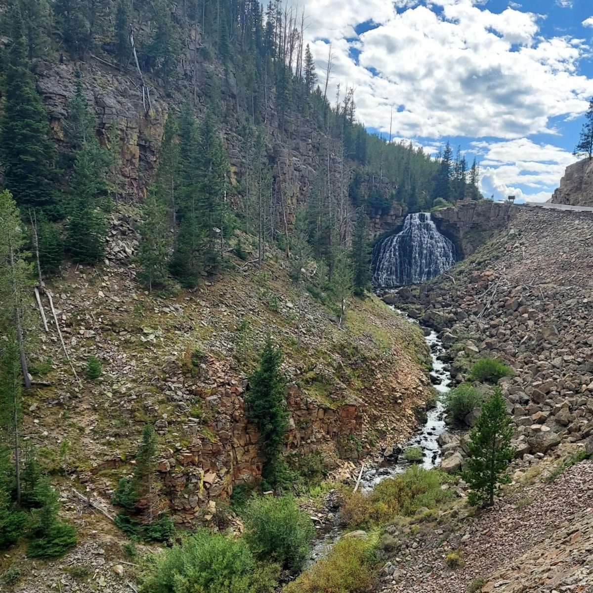 The clear waters of Rustic Falls in Yellowstone National Park are among many sights visitors see on tour with Yellowstone Wild.