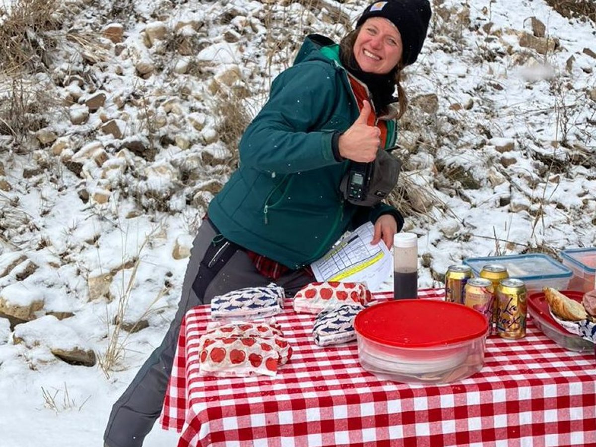 Guests enjoy lunch while on a winter tour with Yellowstone Wild in Yellowstone National Park.