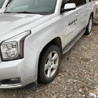 GMC Yukon XL SUVs comfortably fit up to six passengers on tour with Yellowstone Wild in Yellowstone National Park.