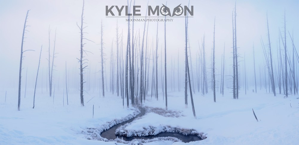 a man riding skis down a snow covered slope