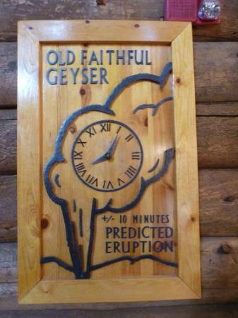 old-faithful-geyser clock a clock on top of a wooden table
