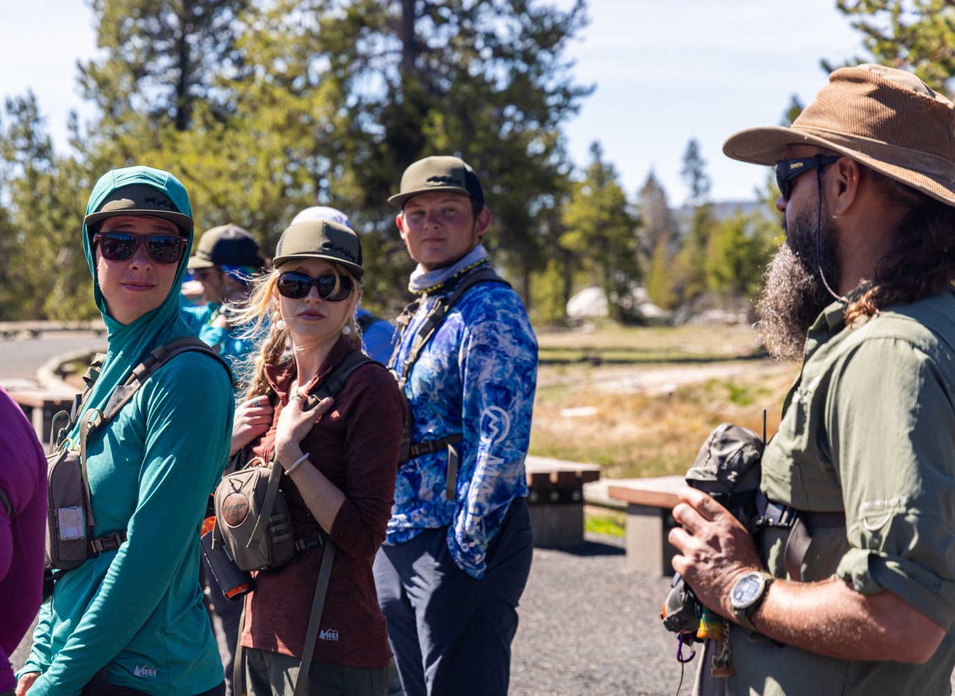 Naturalists Mads, Jesse, and Matthew training on thermals of the Upper Geyser Basin with Lead Naturalist Matt D.