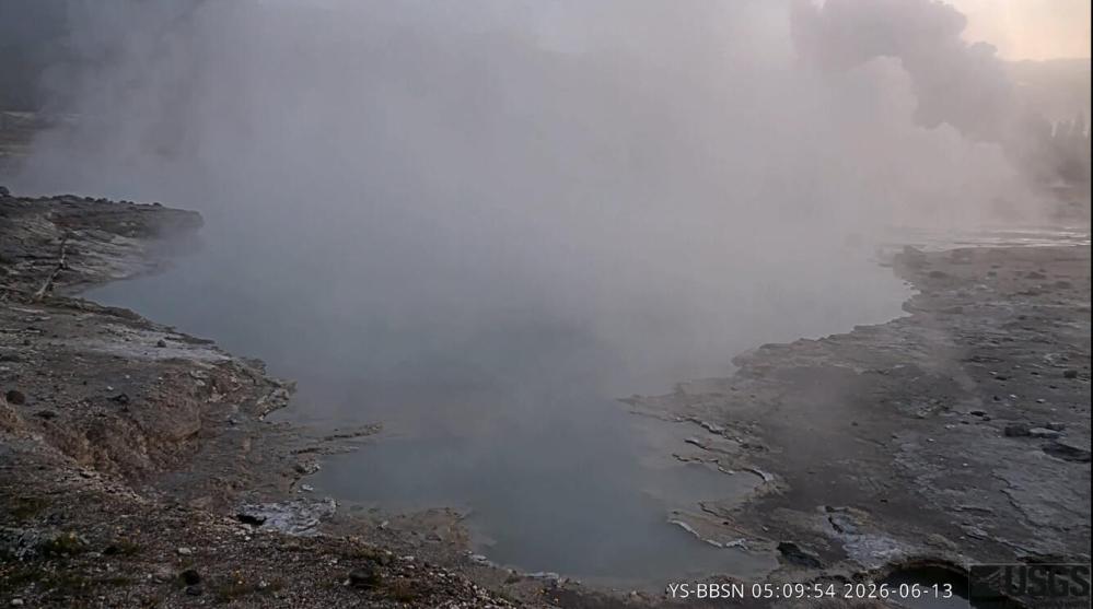 Screen capture showing the view from the Biscuit Basin research and monitoring camera at 05:09:54 a.m. MDT on June 13, 2026. Black Diamond Pool is in the foreground, and a steam plume in the upper right marks the occurrence of a small hydrothermal explosion behind (to the north of) the pool.
